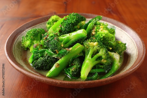 Stir-fried broccoli, vibrant green, on a plate