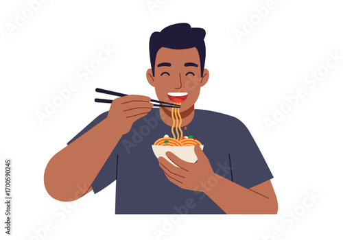 Darkhaired man eats noodles with chopsticks from a white bowl smiling