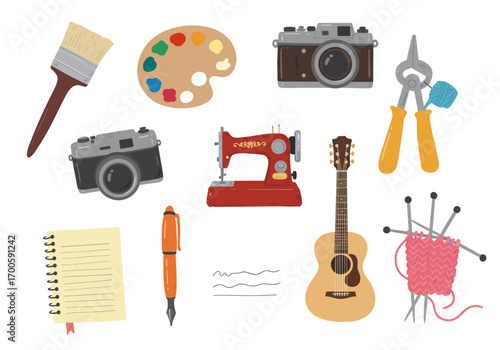 Scattered art and craft supplies cameras palette sewing machine notebook guitar knitting paint brush pen pliers