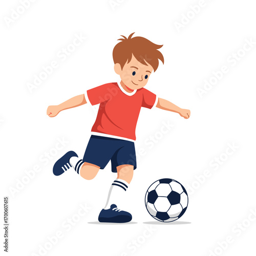 Active young boy enjoying playing soccer outside on a sunny day