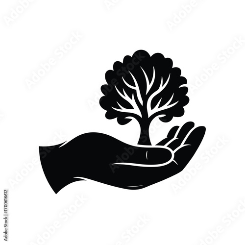 Hand holding a small tree symbolizing growth and nature