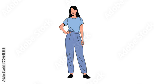 Young woman standing confidently with hand on hip wearing blue t shirt and loose fitting jeans