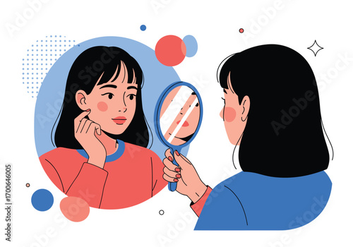 A young woman looks into a handheld mirror admiring her face reflection