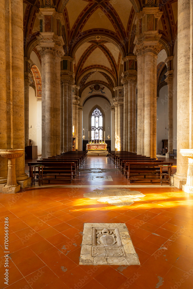 Obraz premium Sunlight illuminating the nave and altar of the Duomo di Pienza in Tuscany, Italy