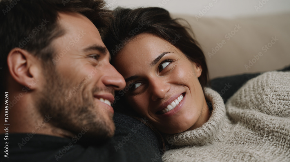 Obraz premium Husband and wife relaxing on comfortable couch.