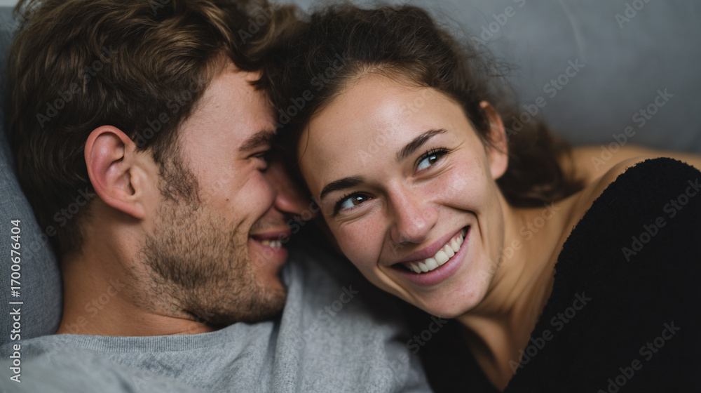 Obraz premium Husband and wife relaxing on comfortable couch.