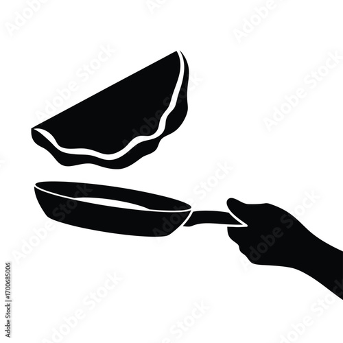 Silhouette of a hand flipping a pancake in a frying pan
