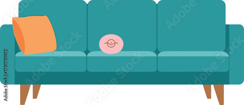 Cozy teal sofa with an orange pillow and a small pink toy resting on the cushions.