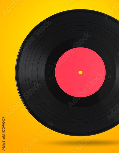 Vinyl record on a vibrant yellow background