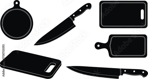 Collection of black kitchen knives and cutting boards on white background