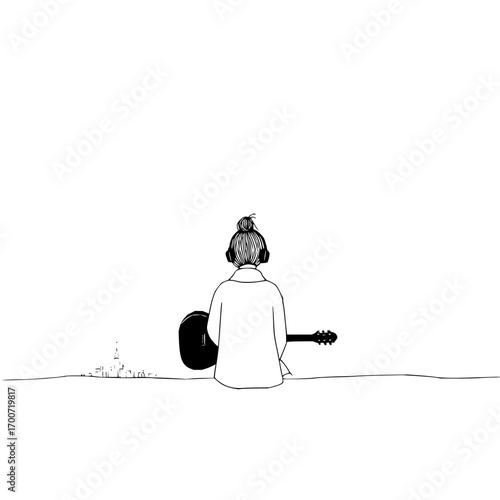 Girl with bun wearing headphones and holding a guitar looking at a city skyline in the distance