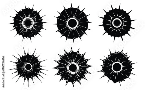 Abstract black and white circular designs with spiky edges and central circles. Impact Holes and Shattered Glass Vector Illustrations