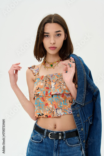 Fashion shooting in studio . Professional model , fashionable clothes and style, new collection. stylish look