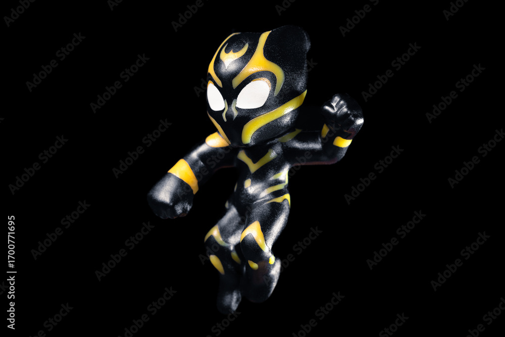 Fototapeta premium Kinder Surprise Marvel Black Panther jumps and hits