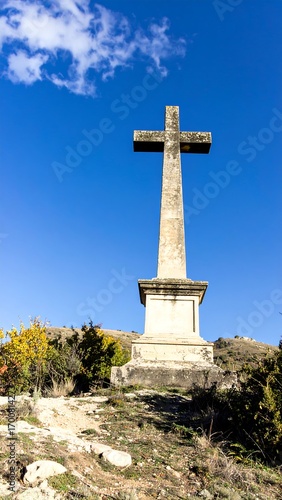 Large stone cross on hilltop