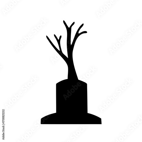 Spooky Halloween graveyard image of a dead tree on a gravestone silhouette