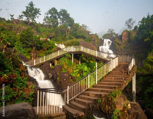 Waterfall steps cascading down a rocky hillside