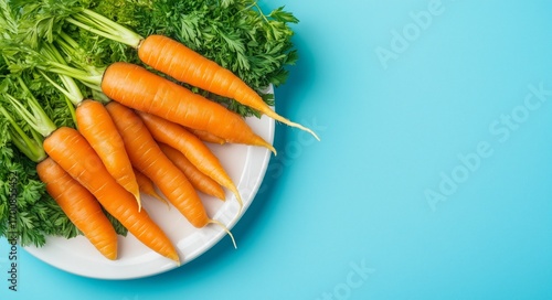 Freshly Harvested Carrots and Greens on a White Plate Against a Blue Background.