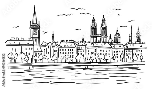 Historic Krakow skyline across the Vistula River featuring Wawel Cathedral spires
