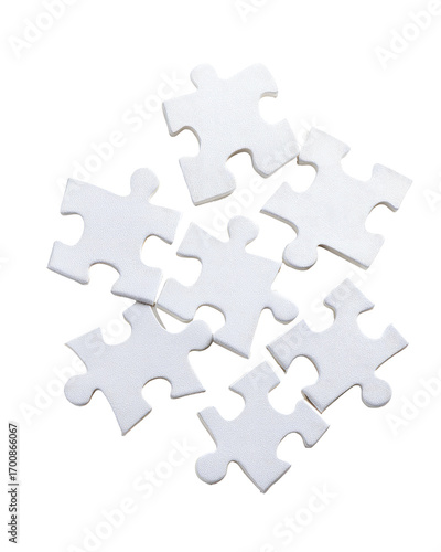 Several white jigsaw puzzle pieces clustered together