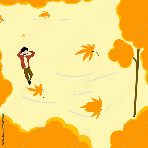 A man lies relaxed on the grass of a park under a tree in the fall, seen from above.
