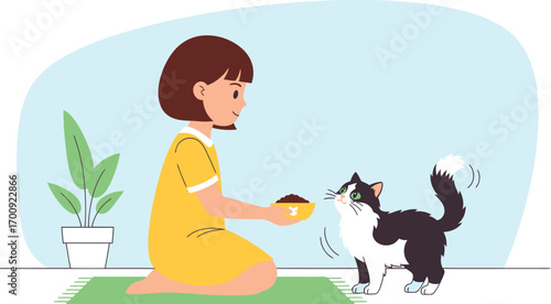 Caring young girl in a yellow dress feeding her happy cat.