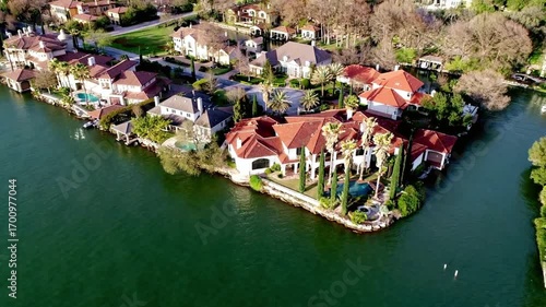 Aerial view of luxury waterfront homes on lake austin, texas on a sunny day