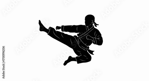 Dynamic Martial Artist Flying Kick Silhouette. Iconic vector graphic for combat sports and fitness themes.