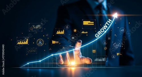 Exponential growth concept. An executive's hand touches a holographic line graph that curves sharply upwards, with the word 