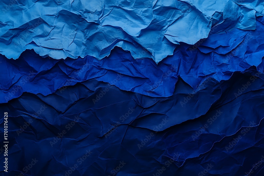 Obraz premium Textured blue crumpled paper layers creating depth and shadow gradient background effect art