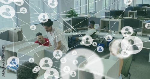 Φωτογραφία Collaborating five office colleagues reviewing desktop monitors in open office,