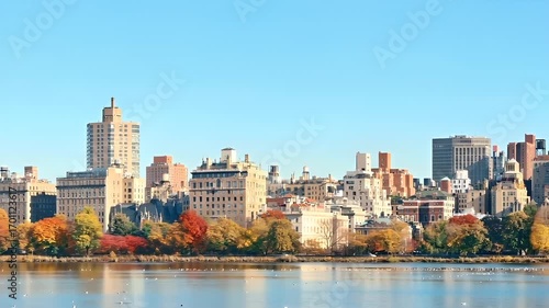 Central park. Manhattan, New York City. Aerial view of a city skyline during autumn, with trees showcasing a mix of autumnal and autumnal hues. The cityscape is dominated by a variety of buildings.