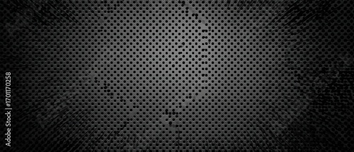 Dark metallic perforated surface with scattered grunge texture creates a compelling industrial or technology background with depth and visual