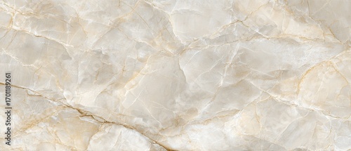 Creamy beige marble surface with detailed veining provides a sophisticated and elegant natural stone texture, perfect for design applications.