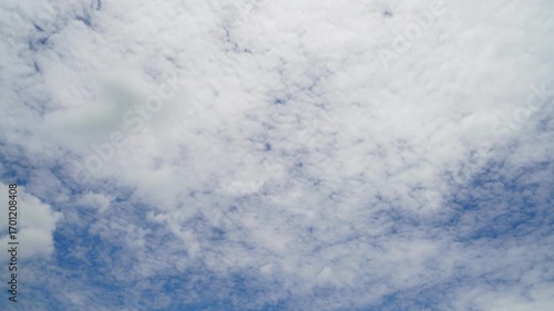 clouds and blue sunny sky,  white clouds over blue sky, Aerial view,  nature, blue sky, white clear weather. Time-lapse video 4 K.
