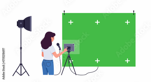 Female content creator recording video in a home studio with a green screen setup, microphone, and tablet for online streaming or vlogging.