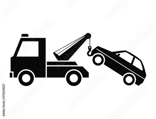 Silhouette of a tow truck lifting a broken down car with its crane