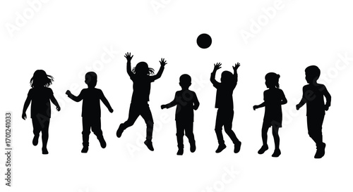 children playing volleyball together outdoors in silhouette form