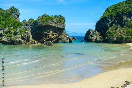A clean small beach surrounded by natural reefs