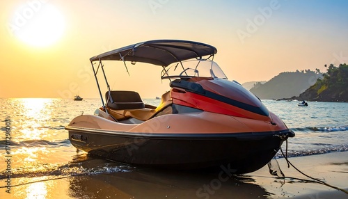 A watercraft, a jet ski, rests on a sandy beach at sunset, bathed in warm golden light.