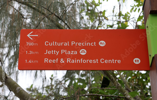 Directional sign pointing towards the Cultural Precinct, Jetty Plaza, Reef & Rainforest Centre at Colleen McLaughlin Park in Cardwell, Queensland, Australia