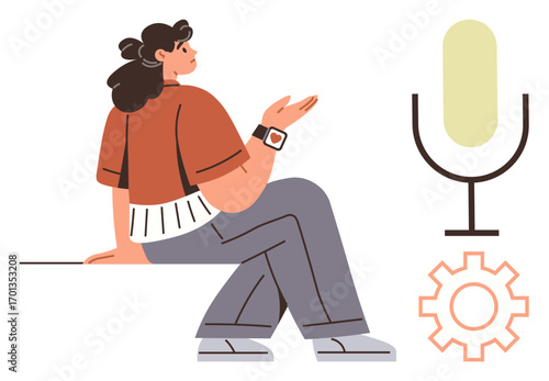 Woman sitting confidently, gesturing while microphone and gear represent audio production setup. Ideal for podcasting, broadcasting, creative process, communication, technology, media, modern