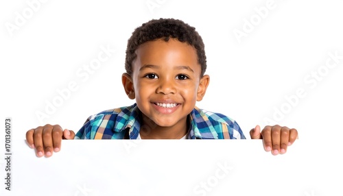 Happy child smiling peeking over a white board