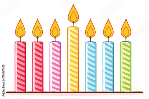 Row of colorful lit birthday candles with striped patterns for celebrations