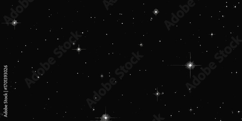 A vast expanse of a dark night sky filled with countless twinkling stars and distant galaxies
