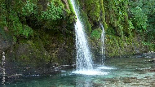 Kaghu waterfall. Magnificent moss covered levitating rock waterfall in the heart of the Caucasus mountains, near Martvili & Balda canyon. Georgia