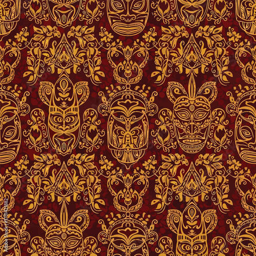 Intricate tribal mask pattern in gold hues on a deep red backdrop design, seamless pattern, royalty free stock.