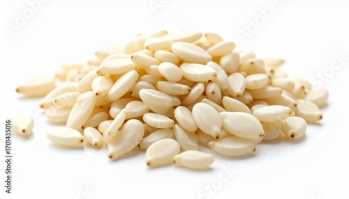 A small pile of white sesame seeds isolated on a white background.