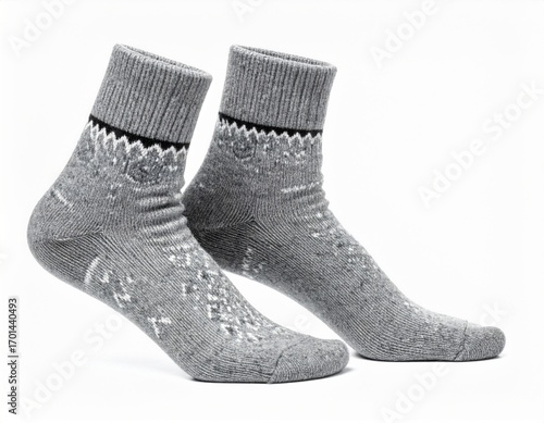 Two Grey Knitted Wool Socks with Black Accents on White Background