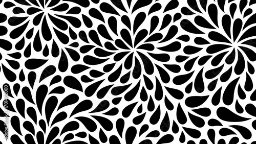 Abstract black and white pattern of flowing teardrop shapes creating a floral or starburst effect